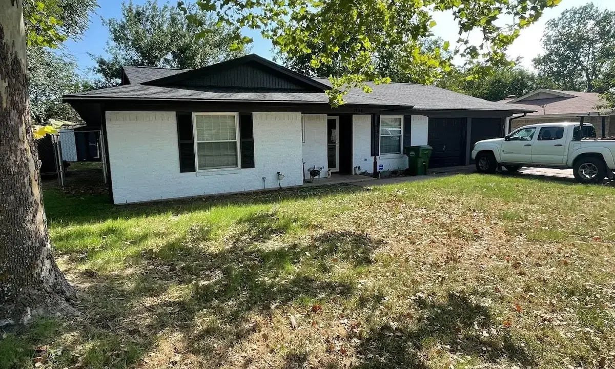 Professional roofing crew working on a residential roof in Moss Bluff